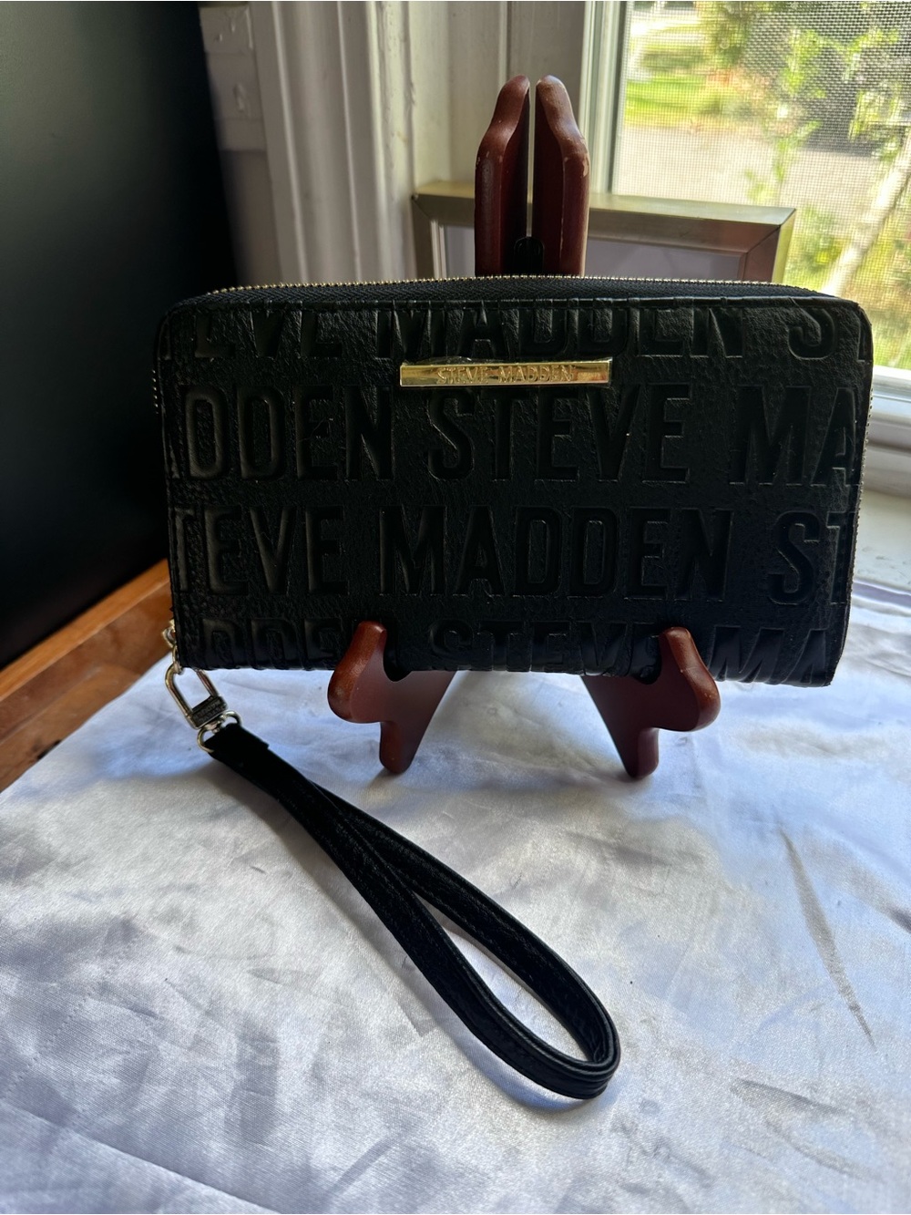 Steve Madden Black Embossed Logo Zip Wristlet with Gold Plate